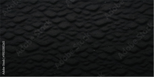 A dark macro closeup reveals the natural rough grain of a black leather texture background, creating a seamless material pattern for fashion design and textured wallpaper backdrops