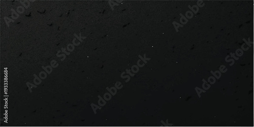 A dark and vintage black and white grunge film background featuring a rough textured stone wall pattern with a dirty concrete surface and old paper material design for a blank backdrop