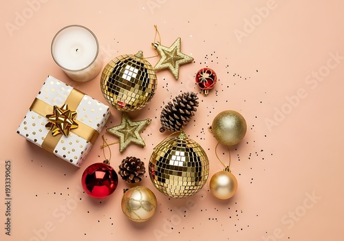 Christmas decorations and gifts on a peach background with ornaments and stars