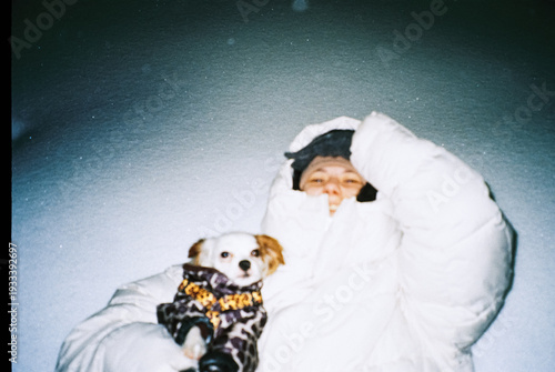 Quiet winter moment with a small dog under the night sky