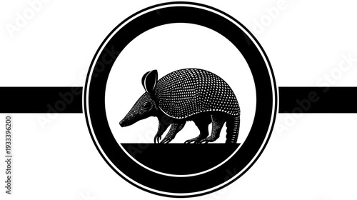 A monochrome illustration of an armadillo within a circular frame, and horizontal bar
