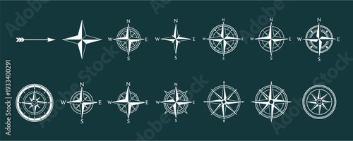 Vintage nautical compass rose and wind rose icon set with maritime navigation symbols for maps travel and adventure designs.