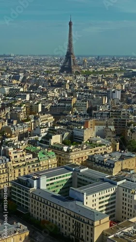 Aerial view of the most beautiful city of Paris in summer with the Seine River and the Eiffel Tower visible on the horizon