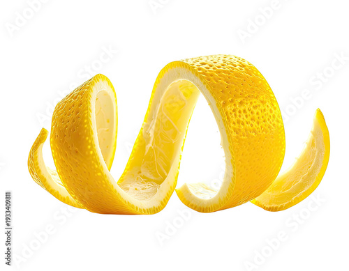 Bright yellow lemon peel artfully twisted against a dark background