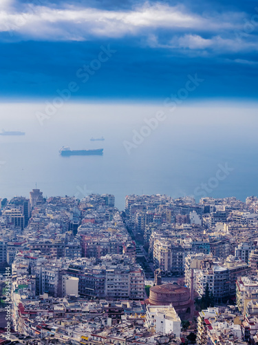 Aerial View of Thessaloniki City and Waterfront Under Dramatic Clouds