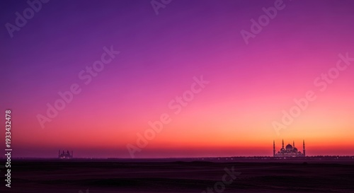 sunset over industrial landscape with mosque