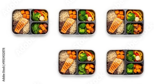 Fresh sushi bento boxes with salmon avocado rolls and vegetables in takeaway containers