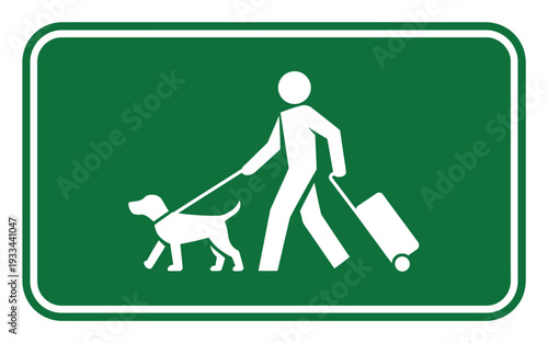 A green sign indicating that pets are allowed in the area with a person walking a dog and pulling a suitcase.