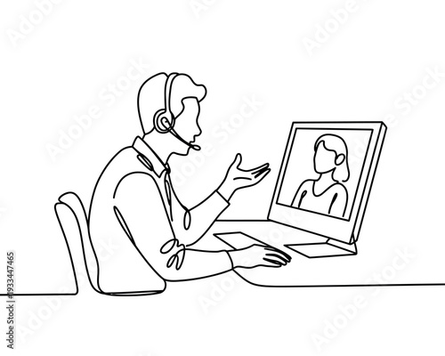 A man wearing a headset is having a video call with a woman on his laptop