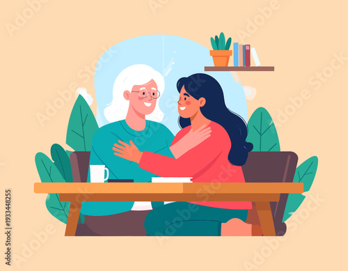 Two women, an older and a younger one, sharing a warm embrace and smiling at a table, depicting a loving relationship.