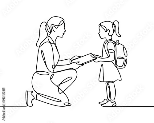 A woman kneeling down and giving a schoolgirl a piece of paper
