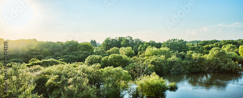 The Ussuri River. View from the bridge to the river. River front. Summer flooding due to continuous-rains, forest flooding
