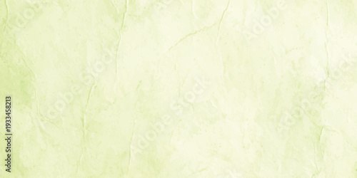 abstract pale lime green watercolor texture background with subtle mottled grunge effect and soft pastel paper grain