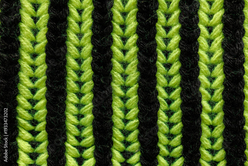 Two color English rib knit pattern in green and black with thick elastic brioche texture