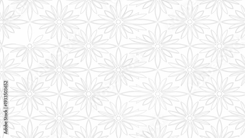 Close-up of a white background with a repeating pattern of gray flower designs in a subtle, intricate arrangement.