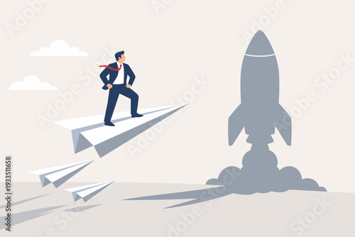 Businessman standing on a flying paper plane with a rocket ship shadow, representing business startup motivation, career growth, ambition, leadership vision, and successful goal achievement concept