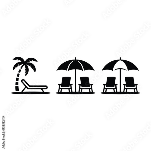 Beach chairs and umbrellas are set up on a sandy shore for relaxation and shade.