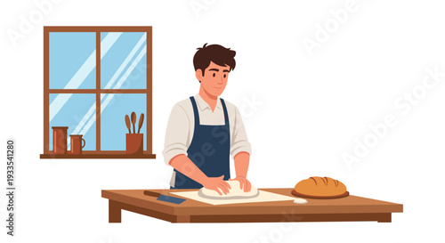 A focused man in a white shirt and blue apron is kneading fresh dough on a wooden table, with a baked bread loaf and a window in the background.