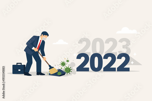 Businessman wearing a face mask sweeping away coronavirus cells into a dustpan, transitioning from 2022 to 2023. Concept of ending the COVID-19 pandemic for a healthy new year and business recovery.
