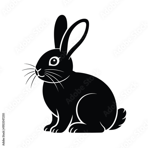 A sleek black silhouette of a rabbit in a sitting position