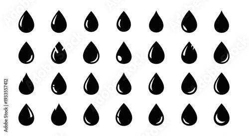 Collection of black oil droplets arranged in a grid pattern on a clean surface viewed from directly above