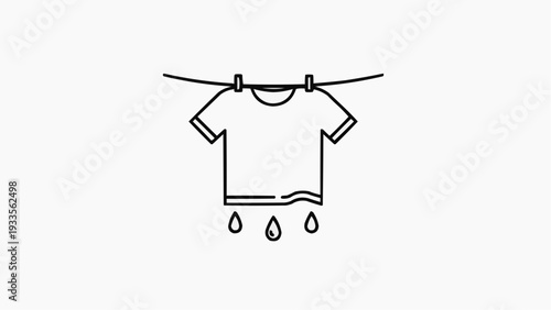 T-shirt drying with water droplets on a clothesline