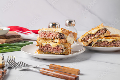 Patty melt hamburger with melted cheese