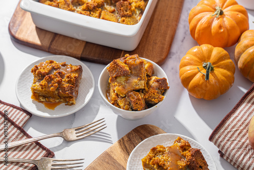 Seasonal fall dessert. Autumn pumpkin bread pudding with sweet caramel sauce