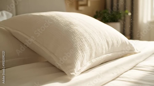 Cozy bedroom pillow fluffing with sunlit ambiance and inviting comfort