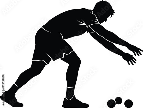 Full body silhouette of a male athlete bending over to throw a ball during a game of bocce, lawn bowls, or outdoor sports competition