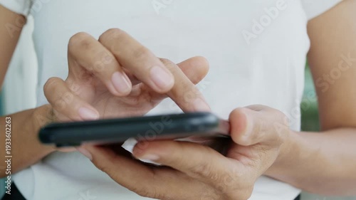 Woman using app mobile phone, hand holding smarphone and feed screen scrolling touth, business technology communication internet online news social media and shopping oOnline black friday.