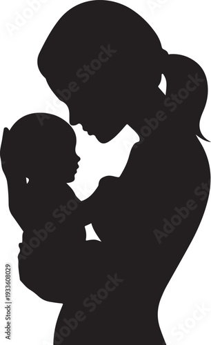 Black silhouette of woman holding and kissing baby