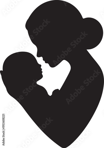 Black silhouette of woman holding and kissing baby