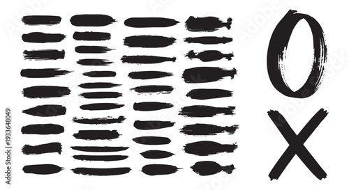 A collection of black brush strokes and symbols on a white background