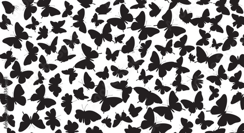 A swarm of black butterflies on a white background