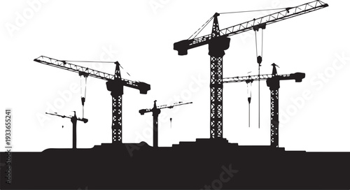 Black silhouette of four construction cranes on a building site