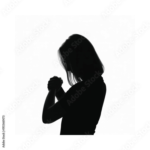Silhouette of a woman with hands clasped in a prayerful pose