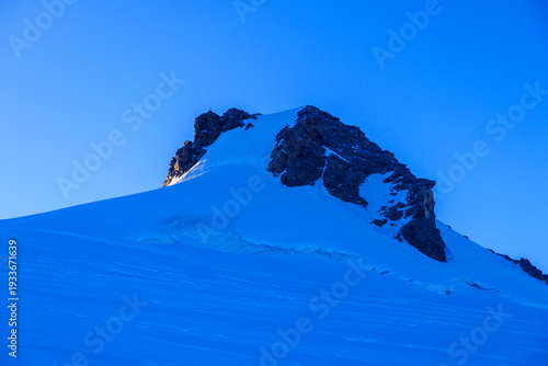 Summit Corno Nero (Schwarzhorn) on mountain Monte Rosa massif with glacier in the morning in Pennine Alps, Italy