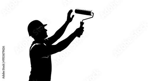 Silhouette painter with roller brush painting wall, construction worker