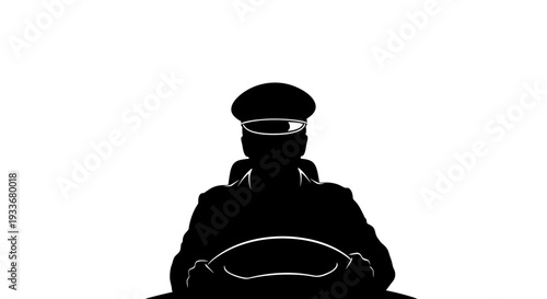 Silhouette of a driver in a cap behind the steering wheel