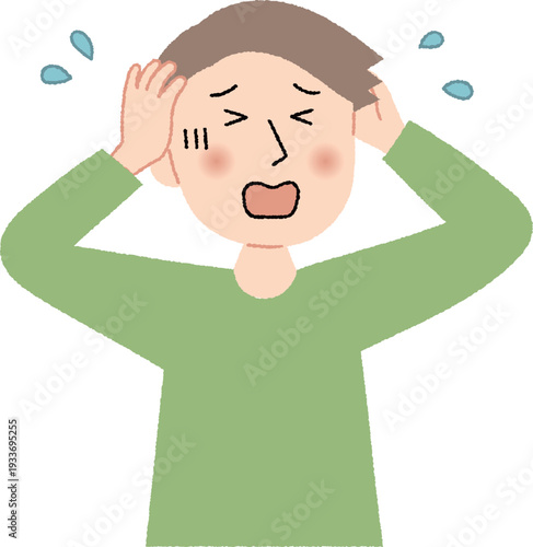 頭を抱えて困っている若い男性