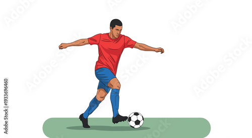 Professional football player in a red jersey and blue shorts dribbling a soccer ball on a green field during an intense match.