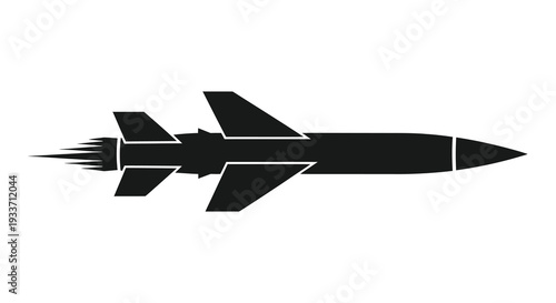 A sleek black missile flies rapidly forward leaving a fiery trail behind it a dramatic silhouette