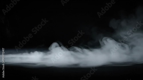 Abstract atmospheric white smoke billows and spreads across a profound black background, evoking a sense of mystery and depth, suitable for creative visual effects and conceptual art