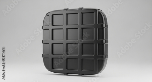 Black textured object with grid pattern.