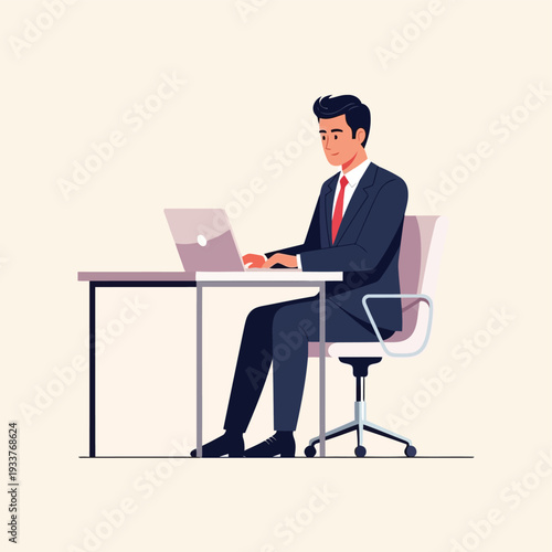 A businessman in a suit and tie sits at a desk and works on a laptop computer, focused on his task