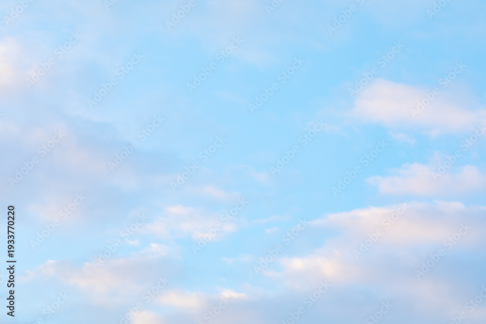 Obraz premium Blue Sky with Soft White Clouds Background