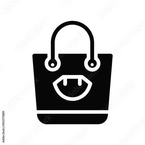 Black tote bag showcasing a white vampire fang emblem and rounded handles looks modern