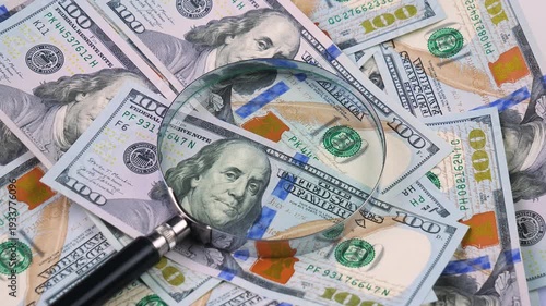 Wallpaper Mural The hands of an elderly accountant sort through US $100 bills and examine them with a magnifying glass. Torontodigital.ca