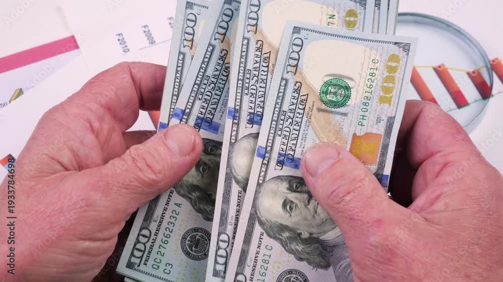custom made wallpaper toronto digitalThe hands of an elderly accountant sort through US $100 bills and count them.
